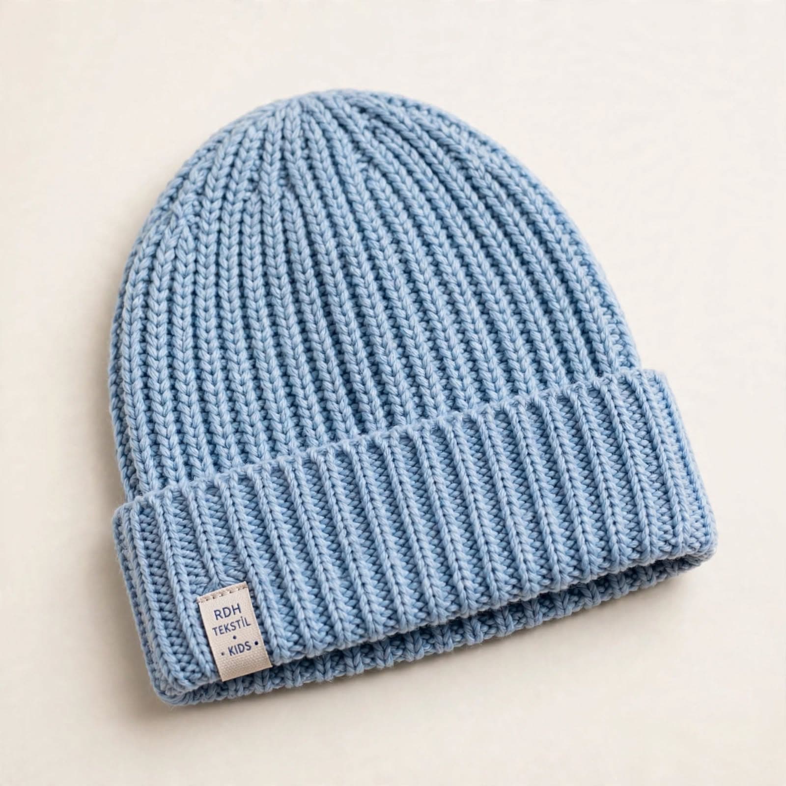 Light blue ribbed kids' beanie with a folded cuff
