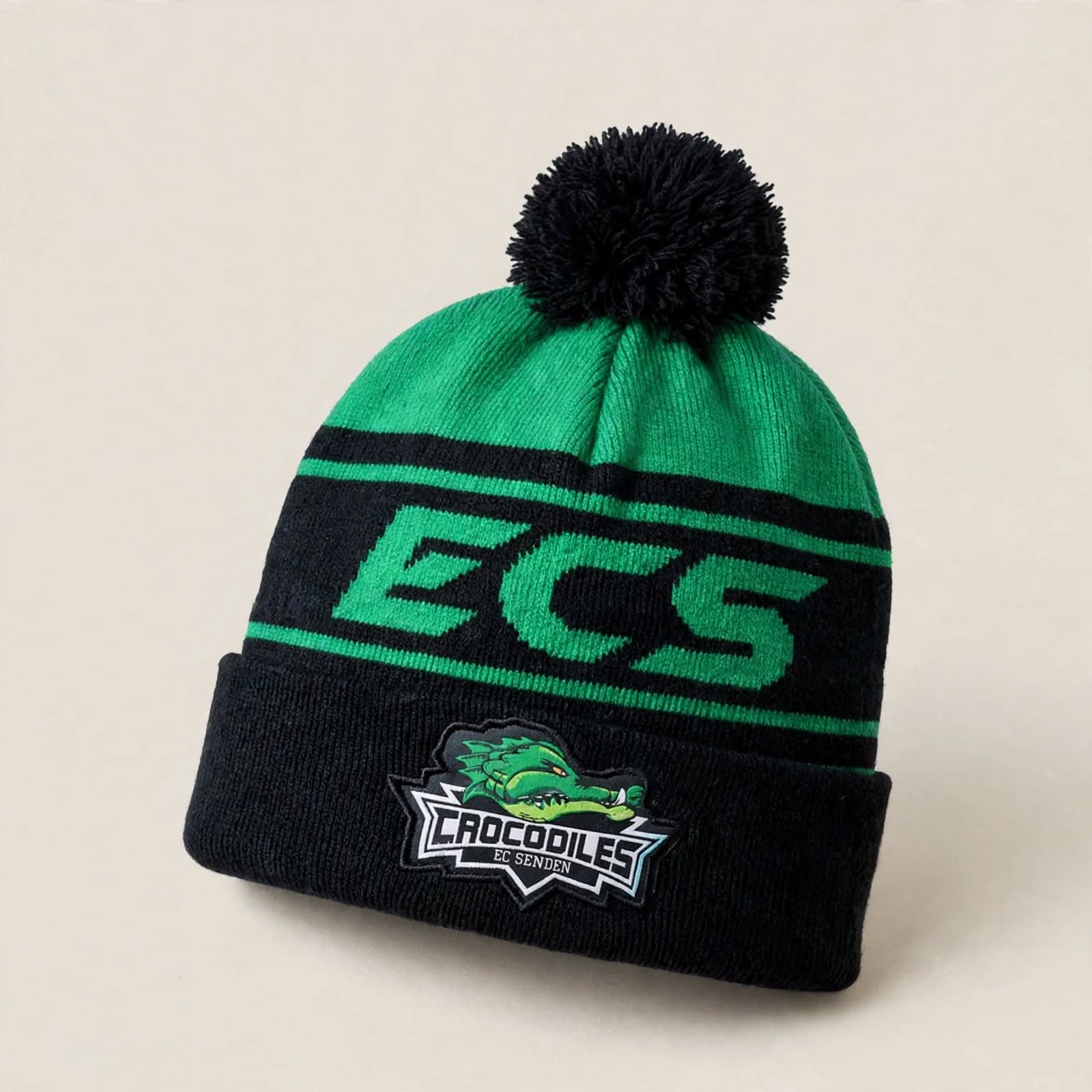 Green and black ECS Crocodiles pompom beanie